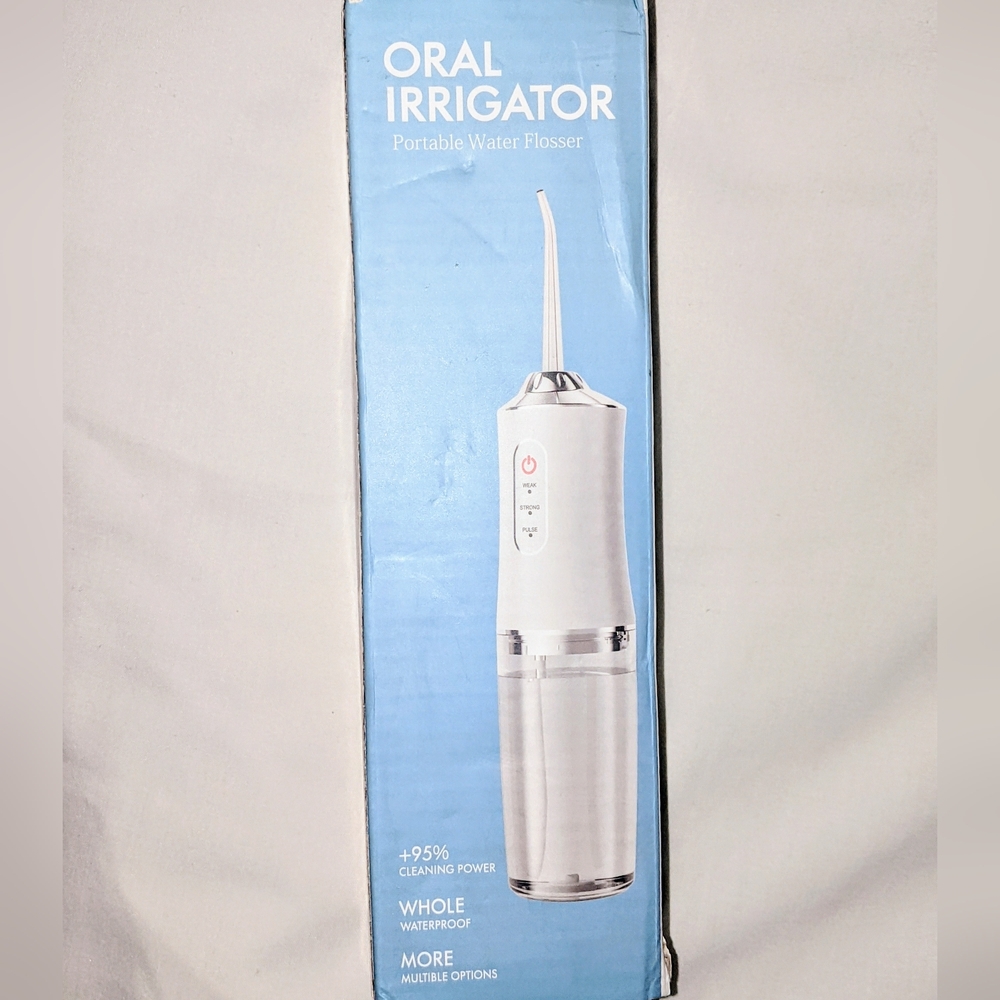 Portable oral irrigator